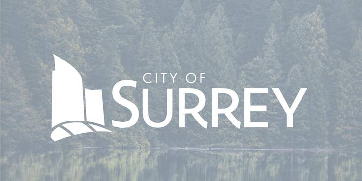 The City of Surrey logo against a backdrop of trees and a lake in British Columbia.