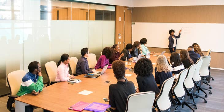 Center Director is having a meeting with teachers in a conference room