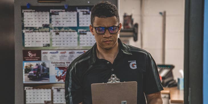 High School Athletic Director checking schedule for the school teams