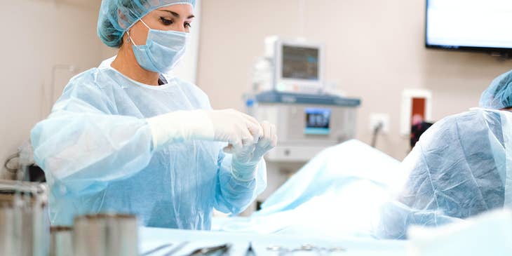 Progressive care nurse prepares sterilized equipment as they prepare for an operation.