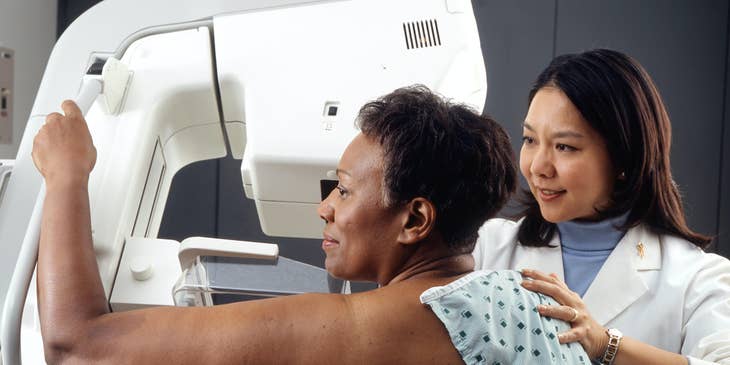 Radiologic Technologist position patient for a mammogram procedure while explaining the procedure