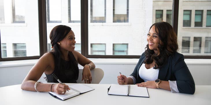 Strategy Consultant laughing with client while discussing new strategies