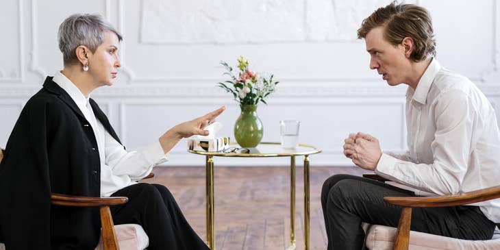 Therapist calms the patient dealing with anger issues during a therapy session