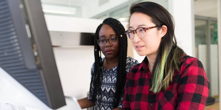 Treasury Assistant reviews with a supervisor if her banking reports filed are accurate