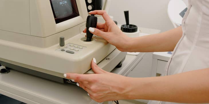 Vascular sonographer positions machine to an accurate position prior to sonogram procedure