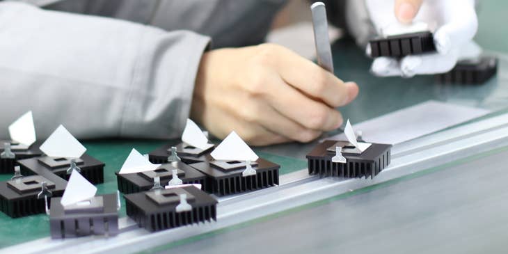 An assembly operator working on building a product.