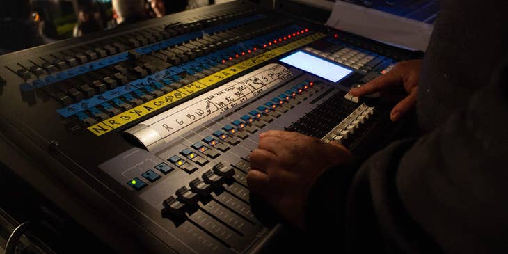 Audio Engineer working on a sound board
