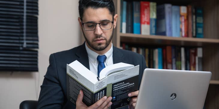 A Bankruptcy Paralegal in an office doing some research on the procedural practices of law.