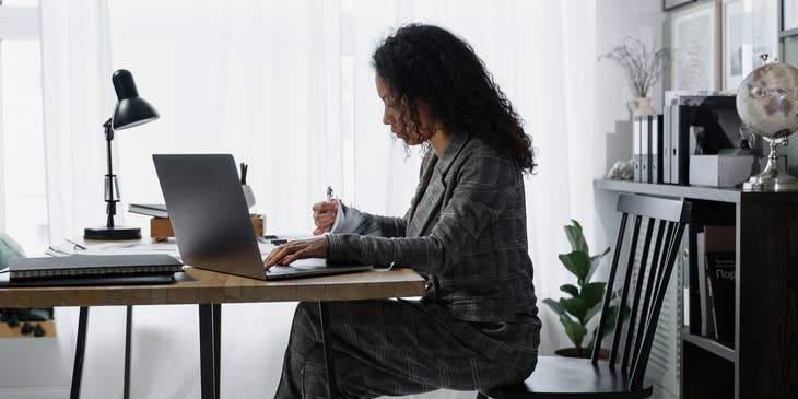 A credit officer working with financial documents at a desk.