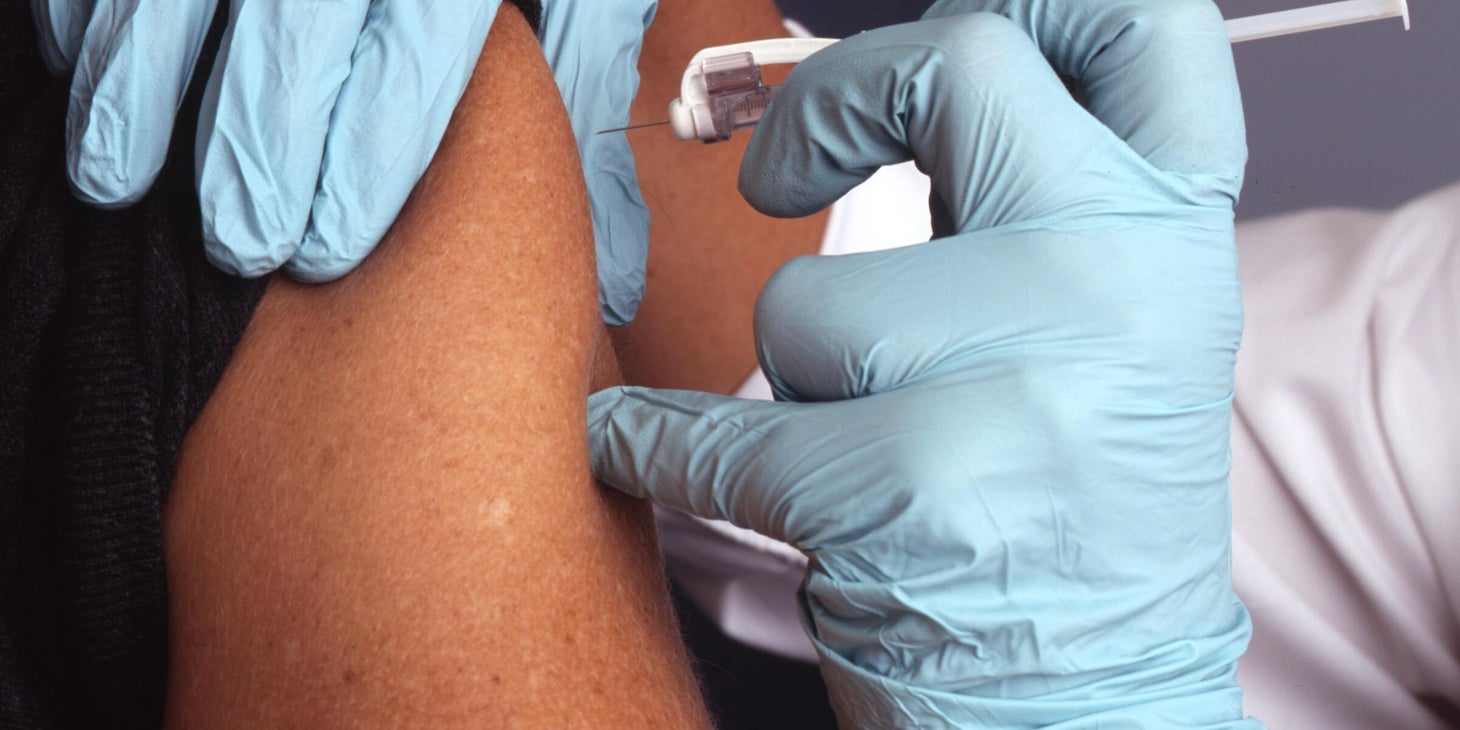 A flu shot nurse administering a vaccination.