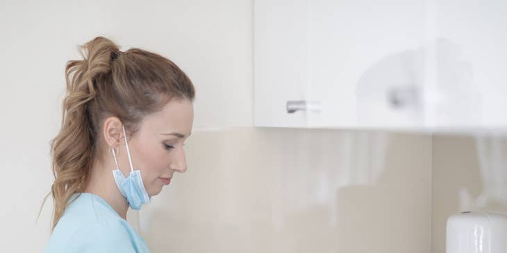 A licensed practical nurse washing hands.