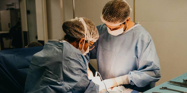 two surgeons working in an operation