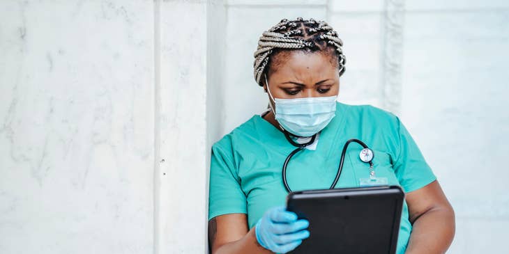 Nurse holding a tablet