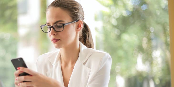 Incident manager using her phone