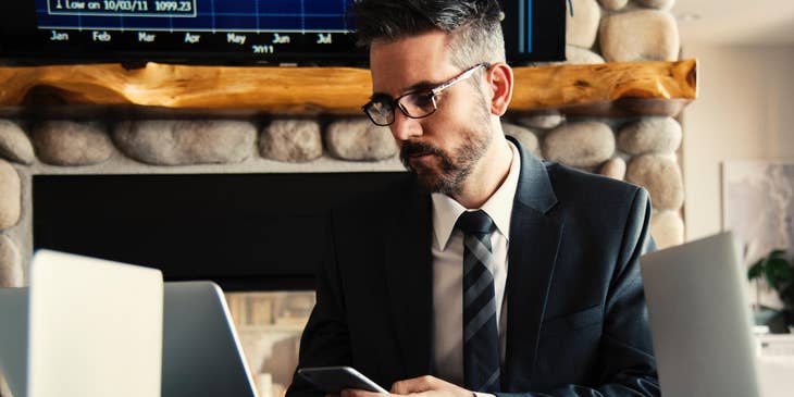 A treasury analyst reviewing financial records on a laptop