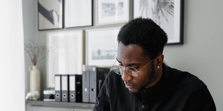 A wealth management associate working behind a desk.