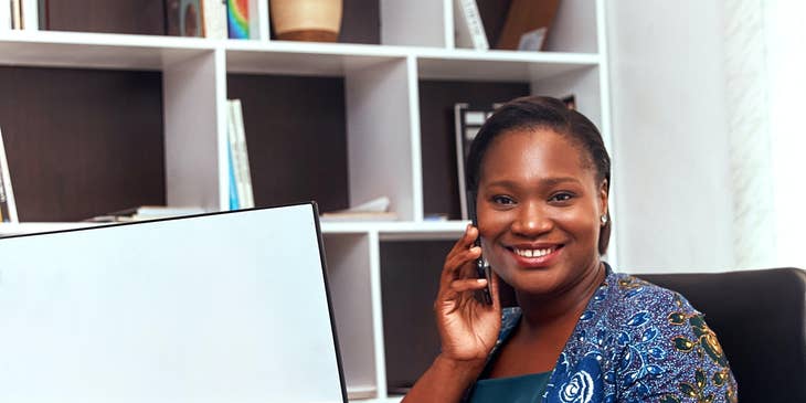 Chiropractic Assistant is answering phone calls and responding to e-mails.