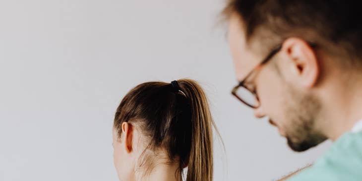 Chiropractor doing spinal manipulation to a patient.