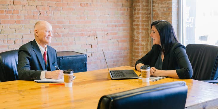 Commercial Loan Officer having discussions with her client inside the meeting room