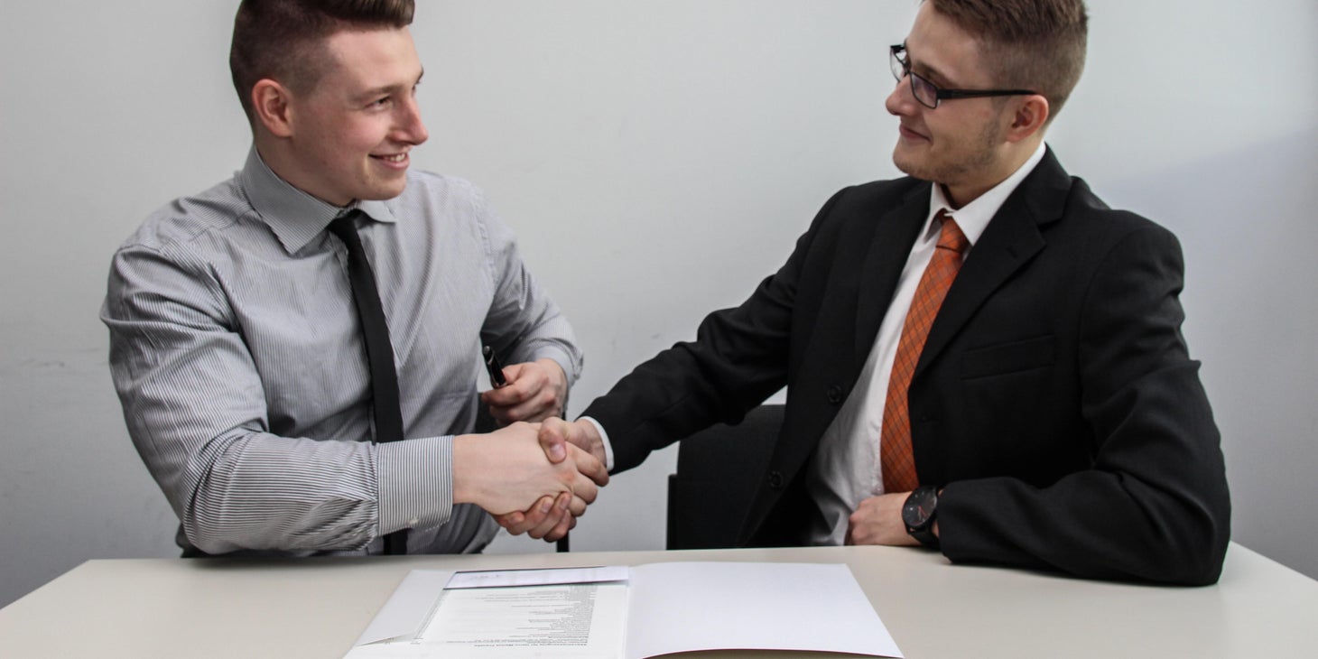 Commercial Real Estate Broker shaking hands with the client after successfully finding a suitable property