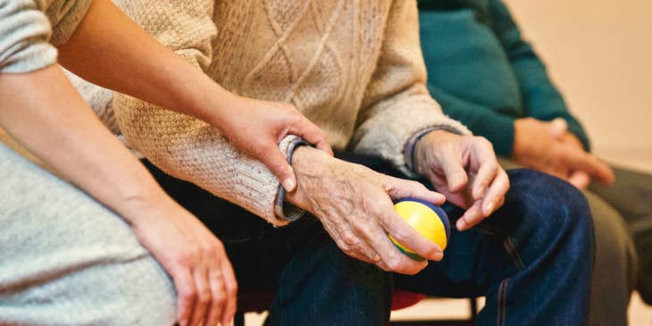 Companion encourages the elderly to participate in a social activity.