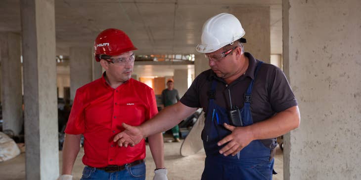 Construction Manager discussing with a Site Engineer.