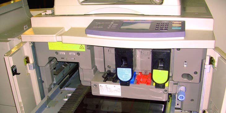 a copier opened to show its inside mechanisms