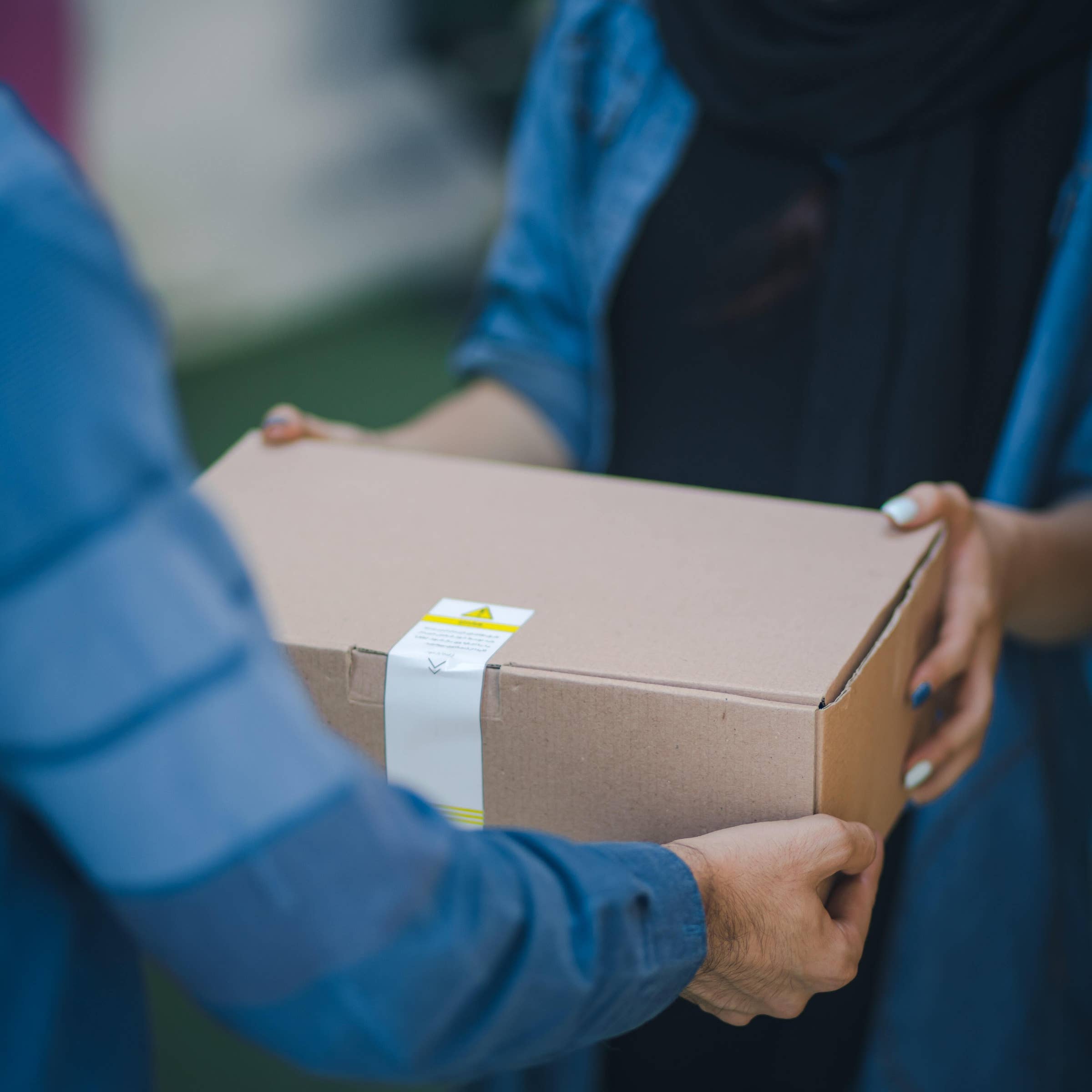 Male courier with orders in car. Food delivery service Stock Photo