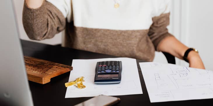 A Demand Planner sitting in an office desk analyzing and planning inventory flow.