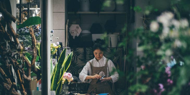 florist cleaning her equipment in a flower shop