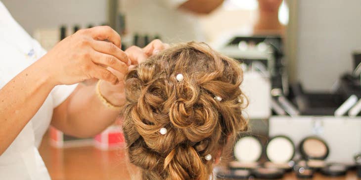 Hairdresser styling a client's hair