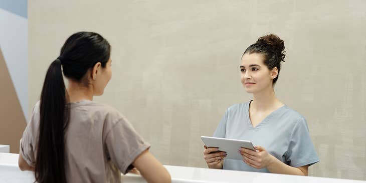 Hospital Scribe talking to a patient