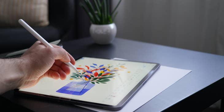 Illustrator drawing an artwork of a flowers in a vase