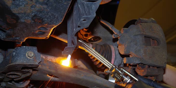 Industrial Maintenance Mechanic repairing an engine