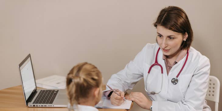 Internist consulting with a patient to understand her health concerns.