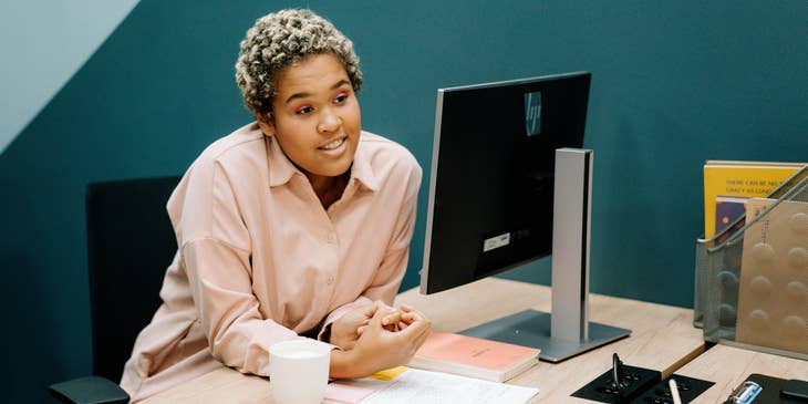 An IT coordinator working in front of a laptop.