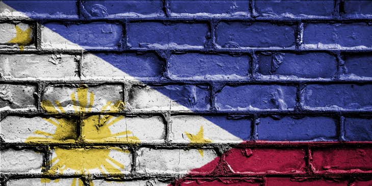 Flag of the Philippines painted on brickface.