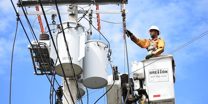 Journeyman Lineman working on power lines