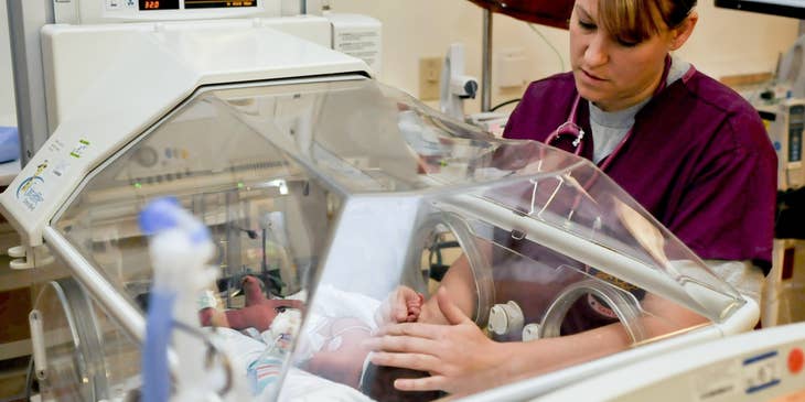 Neonatal nurse practitioner caring for the newborn in the NICU.