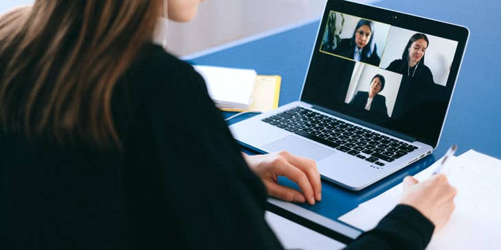 Online marketing executive having a video conference with clients to discuss trends.