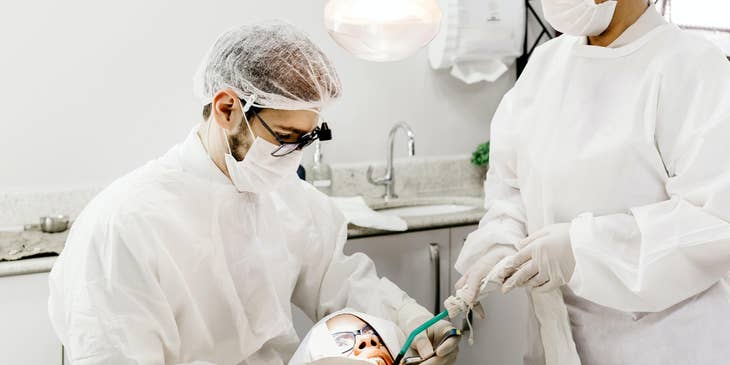 Oral surgeon treating infections of the oral cavity.