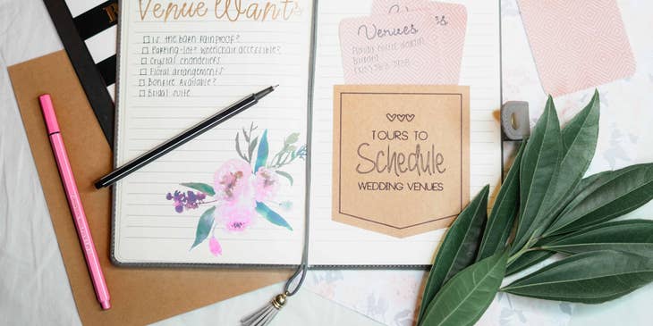 party planner's notes and checklist with pens and clipboard