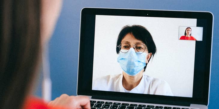 Physician liaison having a virtual meeting with a physician for a potential patient referral.