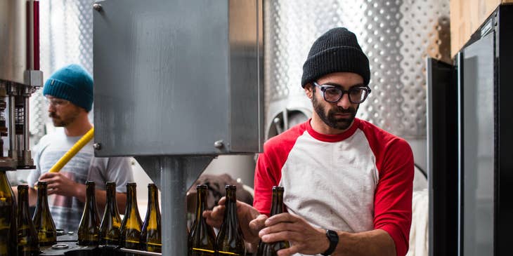 Process technician monitoring and checking the product quality of the newly installed machine if it's up to par with the standards