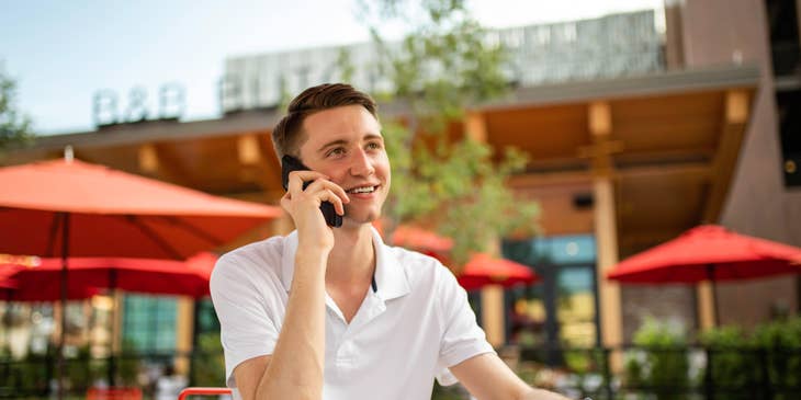 Retail Sales Consultant talking to a client over the phone discussing the company's product