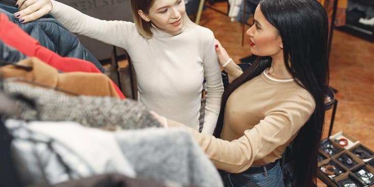 Sales Assistant answering client's questions about the clothes she wanted to buy