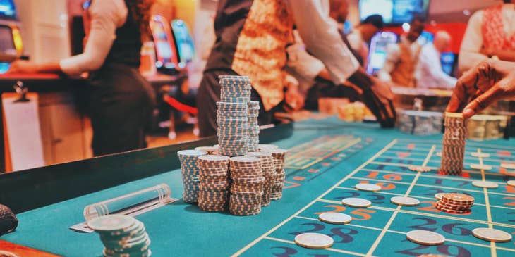 Table Games Dealer preparing cash chips.