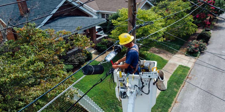 Telecommunications technician checking on the cables