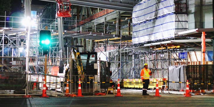 Traffic Marshall ensuring security on construction site.