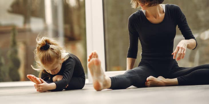 Tumbling Coach teaching a young student to do the forward tilt